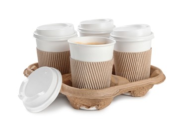 Takeaway paper coffee cups with sleeves in cardboard holder on white background