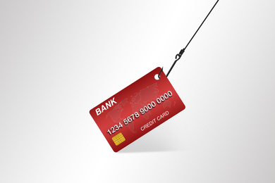 Image of Hook with credit card on white background. Cyber crime