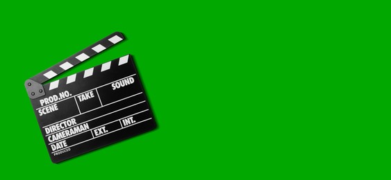 Image of Clapper board on chroma key background, top view. Banner design with space for text