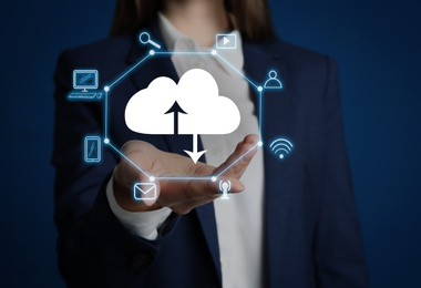 Modern storage technology concept. Woman demonstrating image of cloud with icons on blue background, closeup