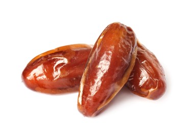 Three tasty sweet dried dates on white background