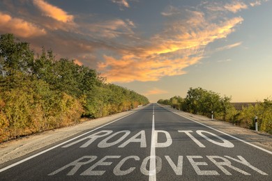 Start to live without alcohol addiction. Phrase ROAD TO RECOVERY on asphalt highway