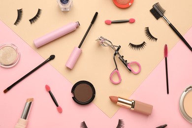 Photo of Flat lay composition with eyelash curler, makeup products and accessories on color background
