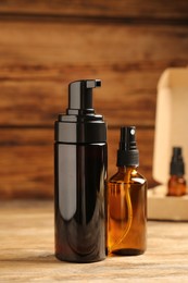 Bottles with oil on wooden table. Natural cosmetics