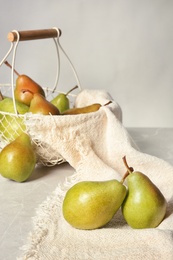 Composition with tasty ripe pears on table