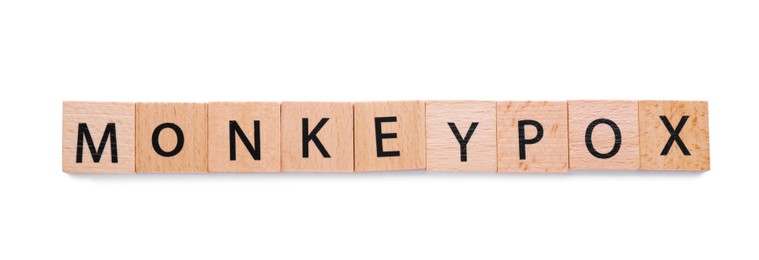 Word Monkeypox made of wooden squares with letters on white background, top view
