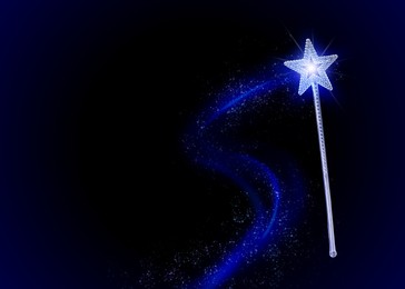 Beautiful magic wand with fairy sparkle on dark background