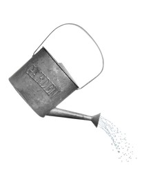 Pouring liquid from watering can on white background