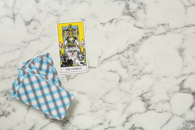 The Chariot and other tarot cards on white marble table, flat lay. Space for text