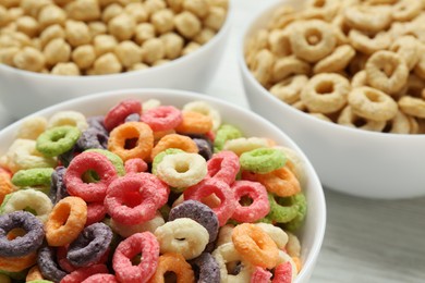 Different delicious breakfast cereals in bowls, closeup