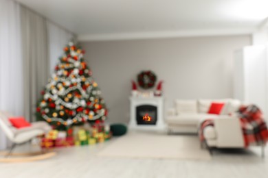 Blurred view of beautiful Christmas tree in stylish living room interior. Bokeh effect