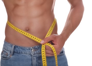 Shirtless man with slim body and measuring tape around his waist isolated on white, closeup