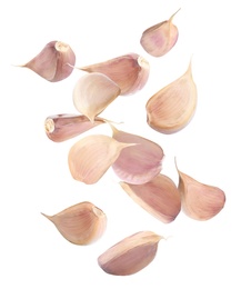 Many garlic cloves falling on white background