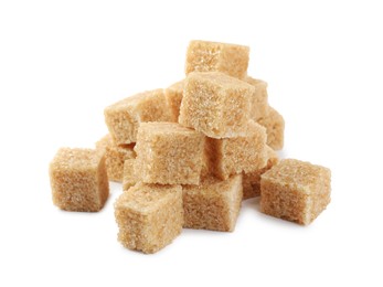 Pile of cubes with brown sugar on white background