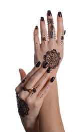 Woman with henna tattoos on hands against white background, closeup. Traditional mehndi ornament
