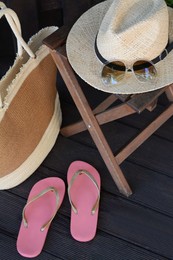 Stylish bag and other beach accessories outdoors