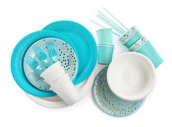 Set of different disposable tableware on white background, top view