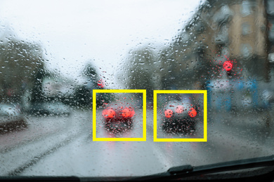 Blurred view of road with scanner frames on cars through wet automobile window. Machine learning