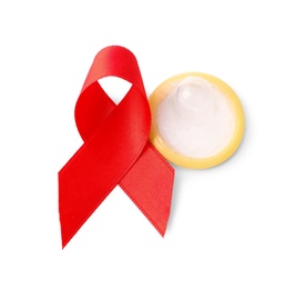 Red ribbon and condom isolated on white. AIDS disease awareness