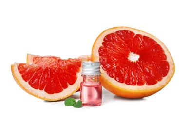 Composition with bottle of grapefruit essential oil on white background