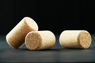 Corks of wine bottles on grey table, closeup