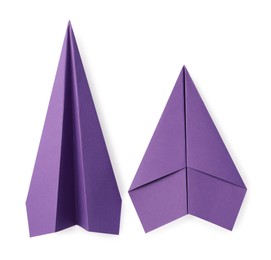 Photo of Handmade purple paper planes isolated on white, top view