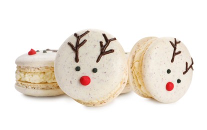 Delicious Christmas reindeer macarons on white background