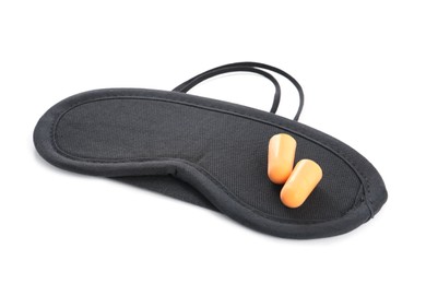 Pair of ear plugs and black sleeping mask on white background