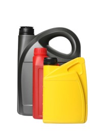 Motor oil in different containers on white background