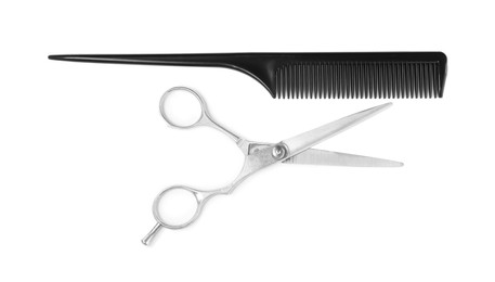 Professional hairdresser scissors and black comb isolated on white, top view. Haircut tools