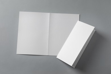Blank paper sheets for brochure on light grey background, flat lay