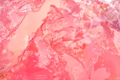 Delicious pink fruit jelly as background, closeup