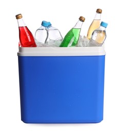 Blue plastic cool box with ice cubes and refreshing drinks on white background