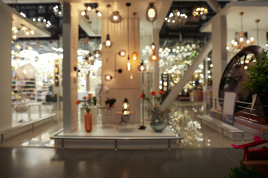 Blurred view of lighting store in shopping mall. Bokeh effect