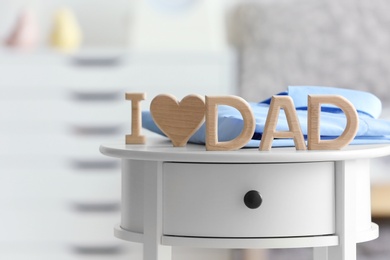 Phrase "I love dad" on table. Father's day celebration