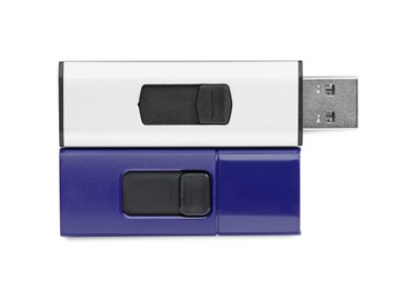 Modern usb flash drives on white background, top view