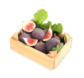 Whole and cut tasty fresh figs with green leaves in wooden crate on white background