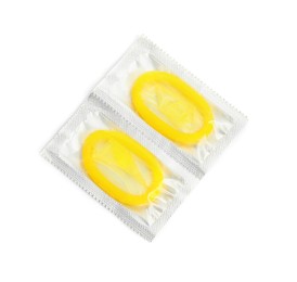 Condom packages on white background, top view. Safe sex