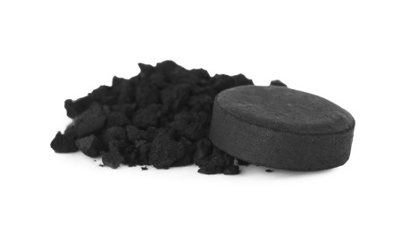 Activated charcoal on white background. Potent sorbent