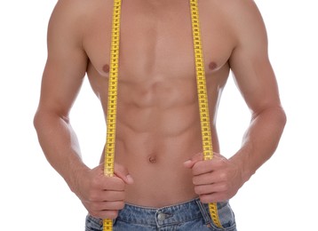 Shirtless man with slim body and measuring tape isolated on white, closeup