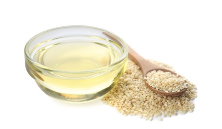 Fresh sesame oil and seeds on white background