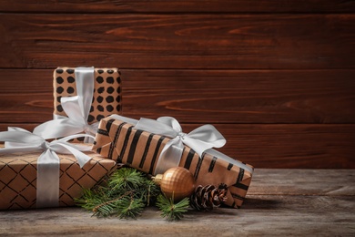 Beautiful composition with gift box and Christmas decorations on wooden table
