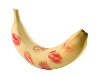 Banana covered with red lipstick marks isolated on white. Potency concept
