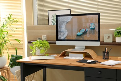 Photo of Comfortable workplace near window in room. Interior design