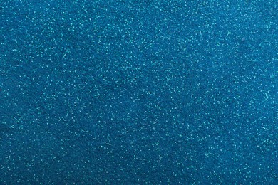 Shiny light blue glitter as background, closeup