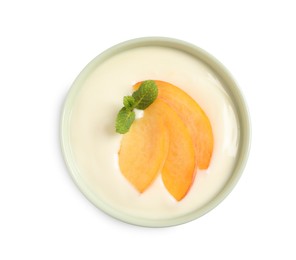 Delicious yogurt with fresh peach and mint in bowl on white background, top view