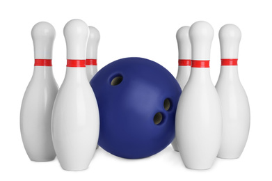 Blue bowling ball and pins isolated on white