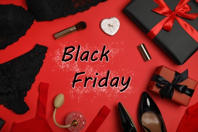 Gift boxes, women's underwear, shoes, accessories and phrase Black Friday on red background, flat lay