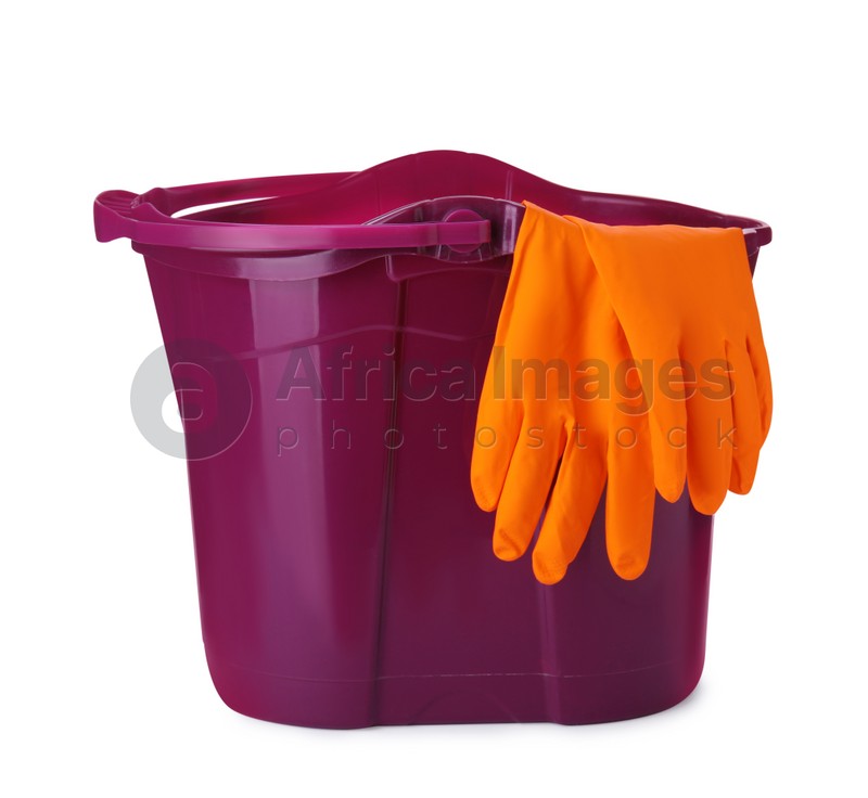 Purple bucket with gloves isolated on white
