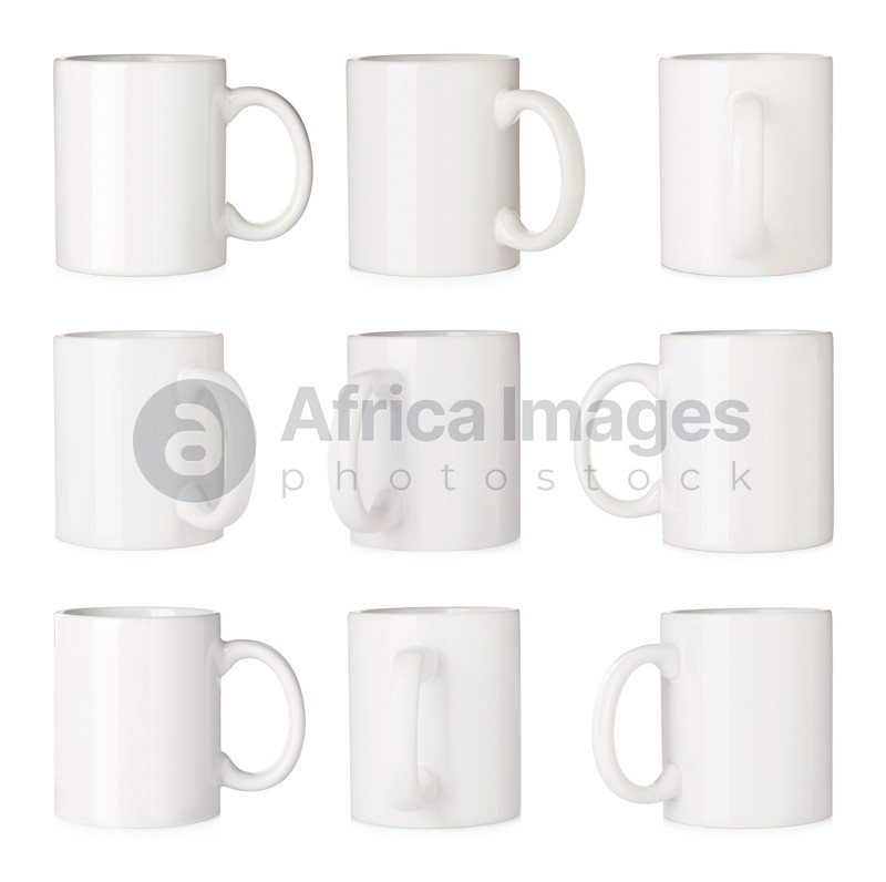 Set with ceramic mugs on white background